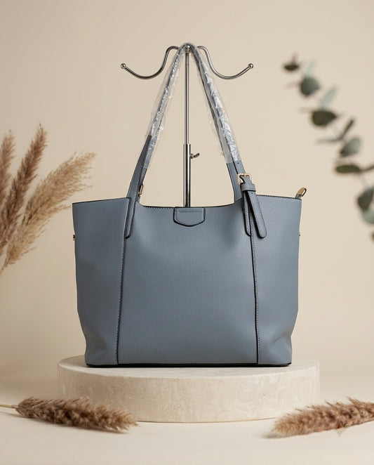 Powder blue structured faux leather shoulder tote bag with top handles and front seam panel