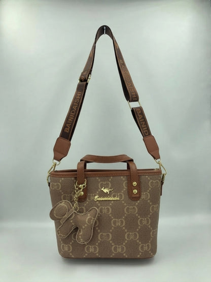 Brown and tan monogram tote bag with shoulder straps and front animal charm