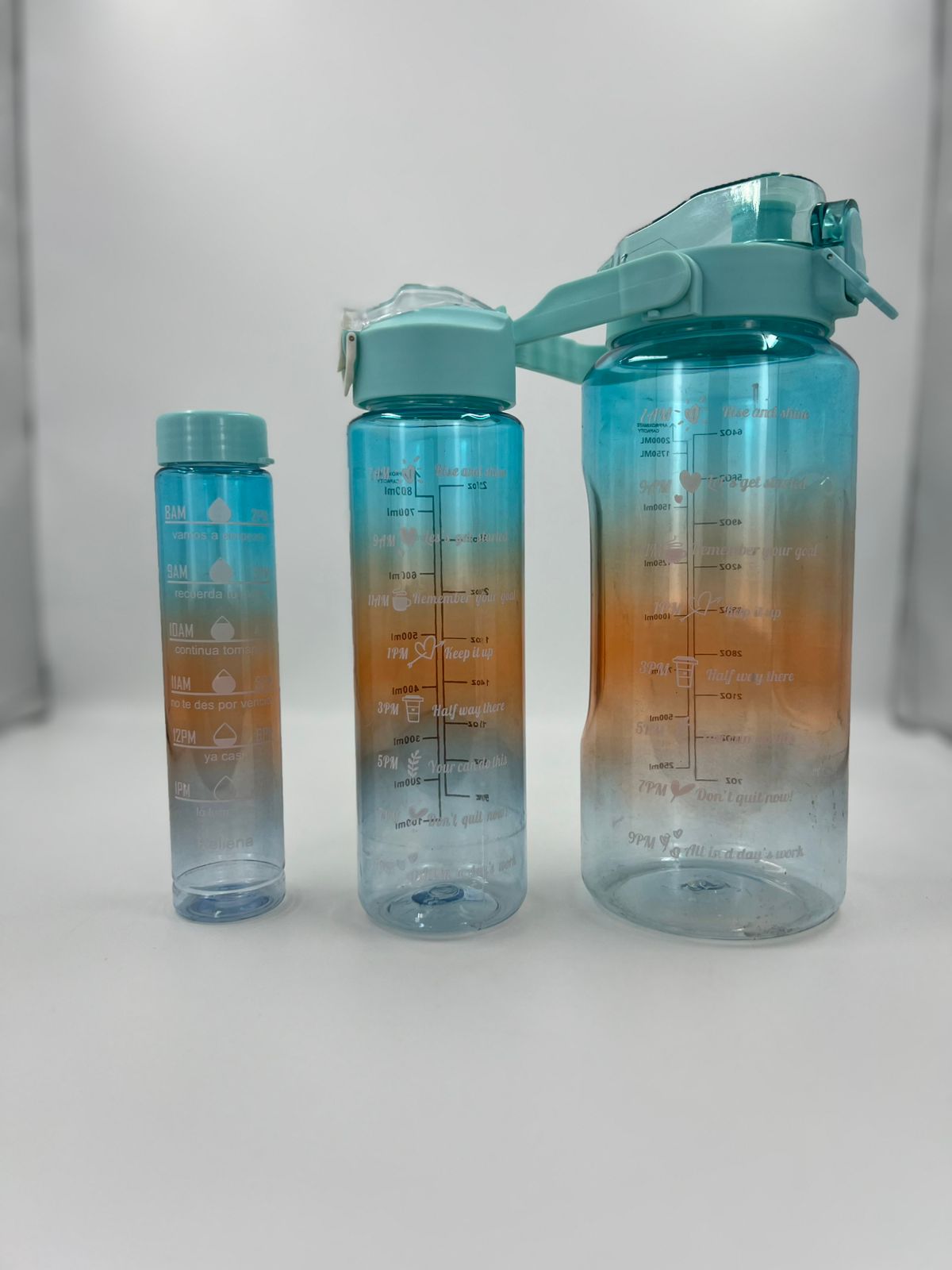 3-piece gradient motivational water bottle set, teal-to-amber with flip caps and carry loops