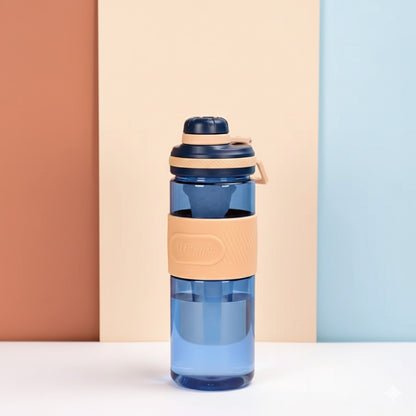 Blue insulated water bottle with beige silicone sleeve and dark lid