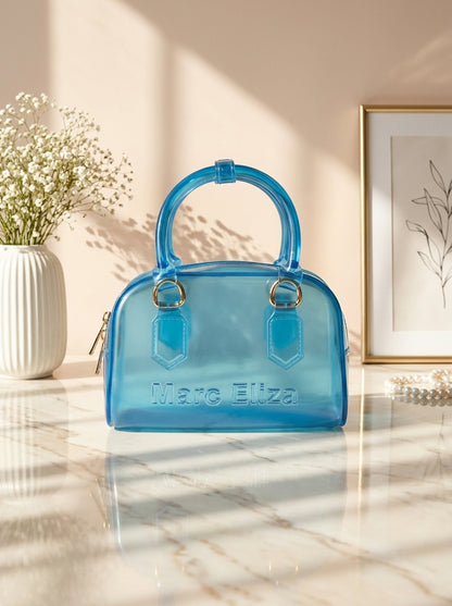 Blue jelly barrel handbag with top handles, zip closure, and Marc Eliza logo.
