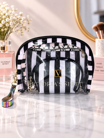 Black and white striped cosmetic organizer with clear zip pouches and V logo patch