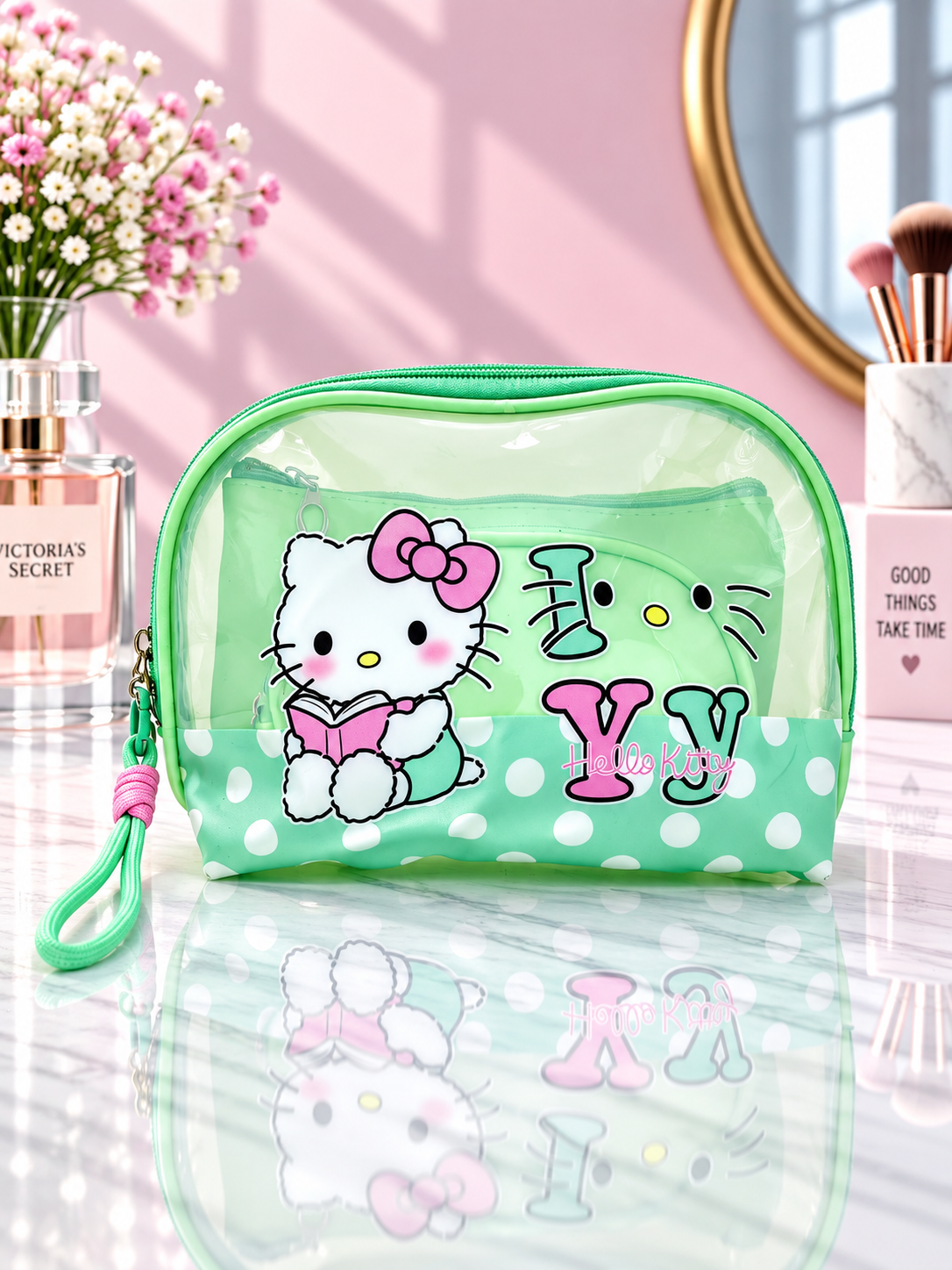 Green polka dot Hello Kitty 3-in-1 cosmetic organizer with clear zip pouch and wrist strap