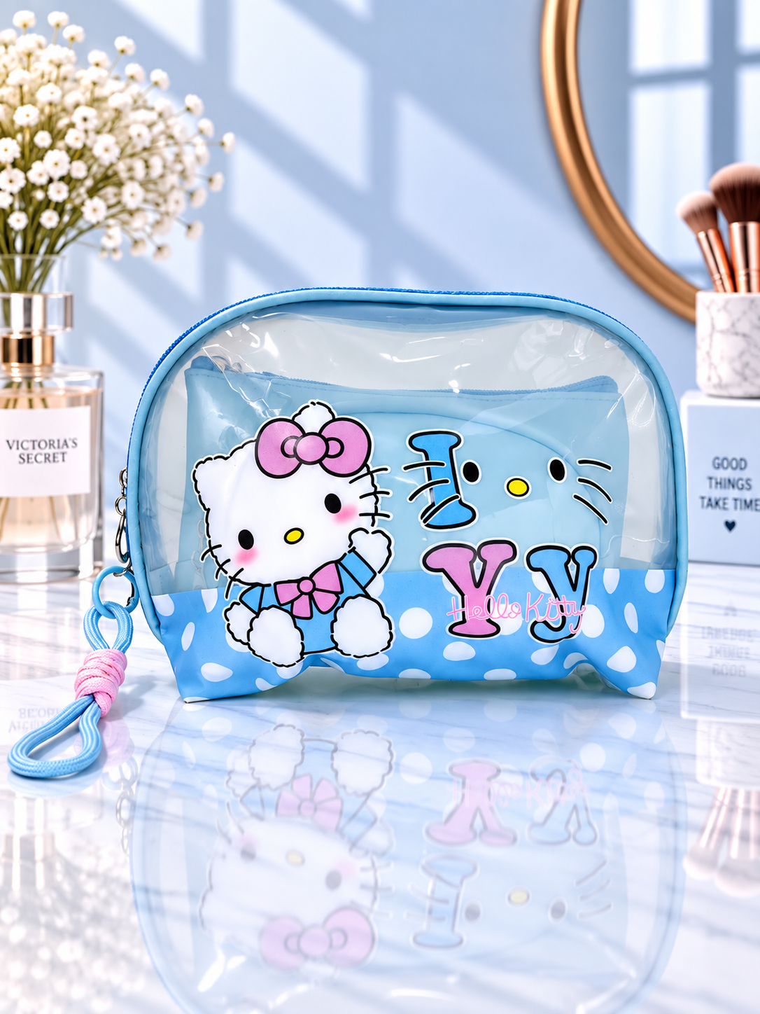 Blue polka dot Hello Kitty 3-in-1 cosmetic organizer with clear zip pouch and wrist strap