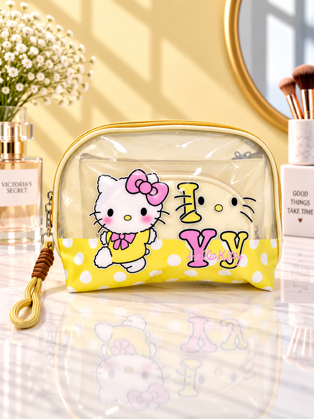 Yellow polka dot Hello Kitty 3-in-1 cosmetic organizer with clear zip pouch and wrist strap