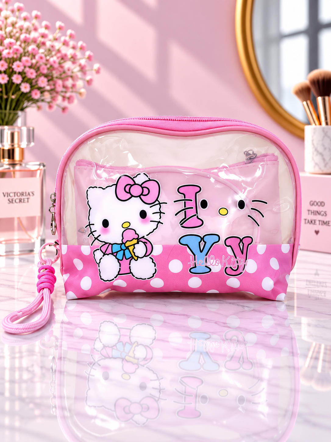 Pink polka dot Hello Kitty 3-in-1 cosmetic organizer bag with clear zip pouch and wrist strap