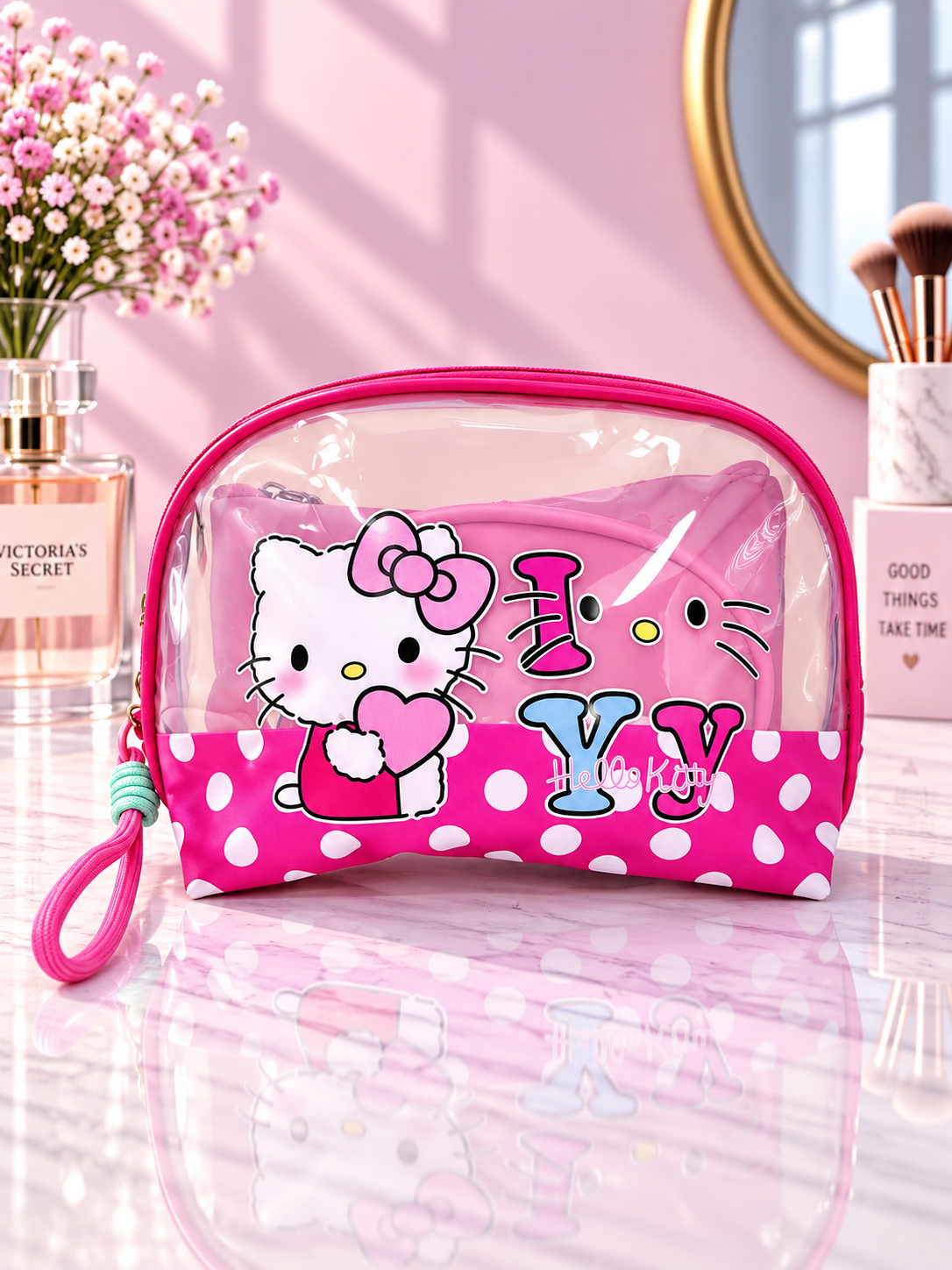 Pink polka dot Hello Kitty 3-in-1 cosmetic organizer with clear zip pouch and wrist strap