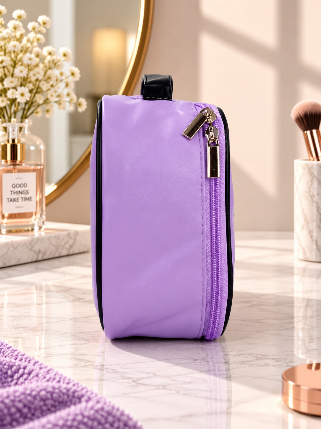 Purple cosmetic bag with black handle and zip closure, side view