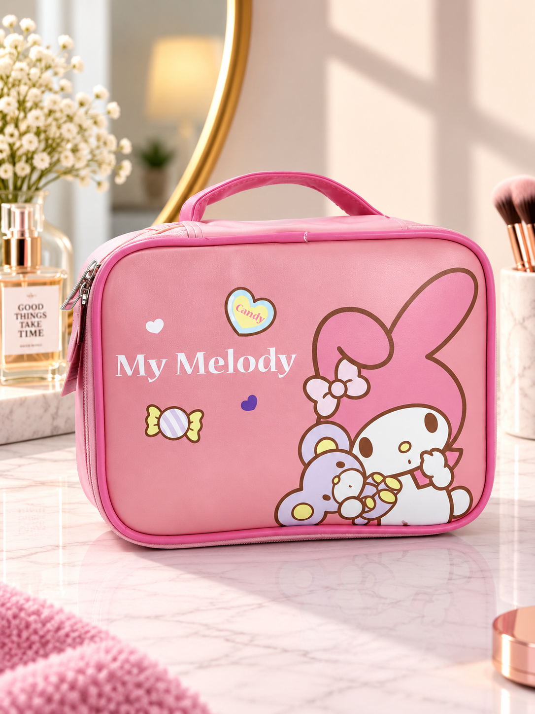 Pink cartoon character cosmetic bag with top handle and front zip closure