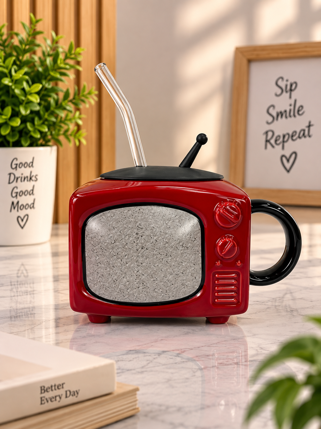 Red ceramic TV-style mug with black handle, lid, and dark speaker-screen