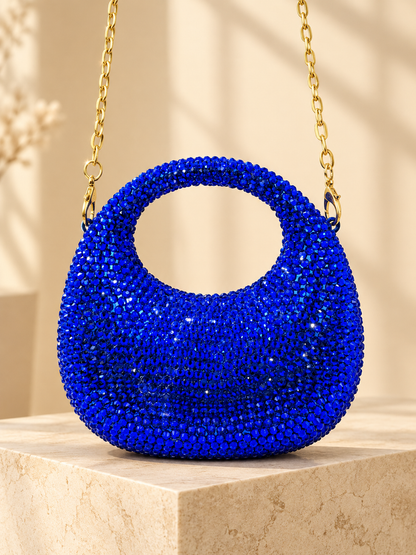Blue crystal-encrusted circular evening handbag with gold chain handle