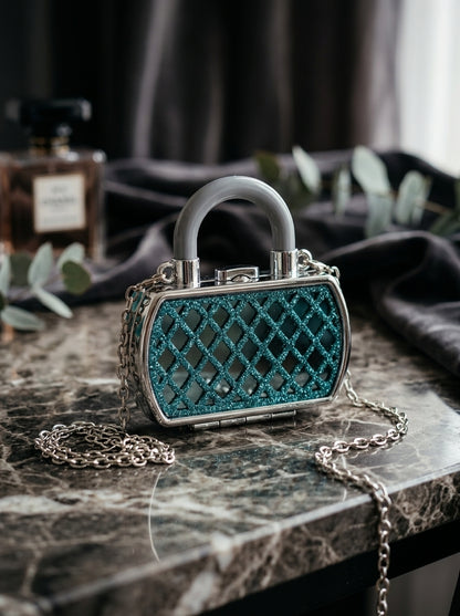 Teal glitter lattice evening clutch with top handle and silver chain strap
