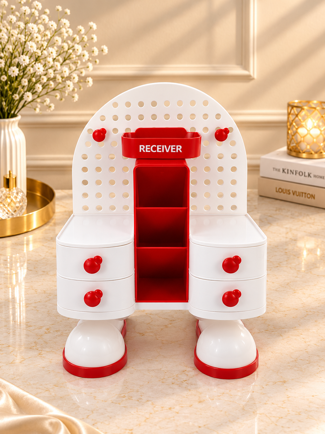 Red and white pegboard vanity organizer stand with central receiver slot and side drawer bins