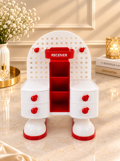 Red and white pegboard vanity organizer stand with central receiver slot and side drawer bins