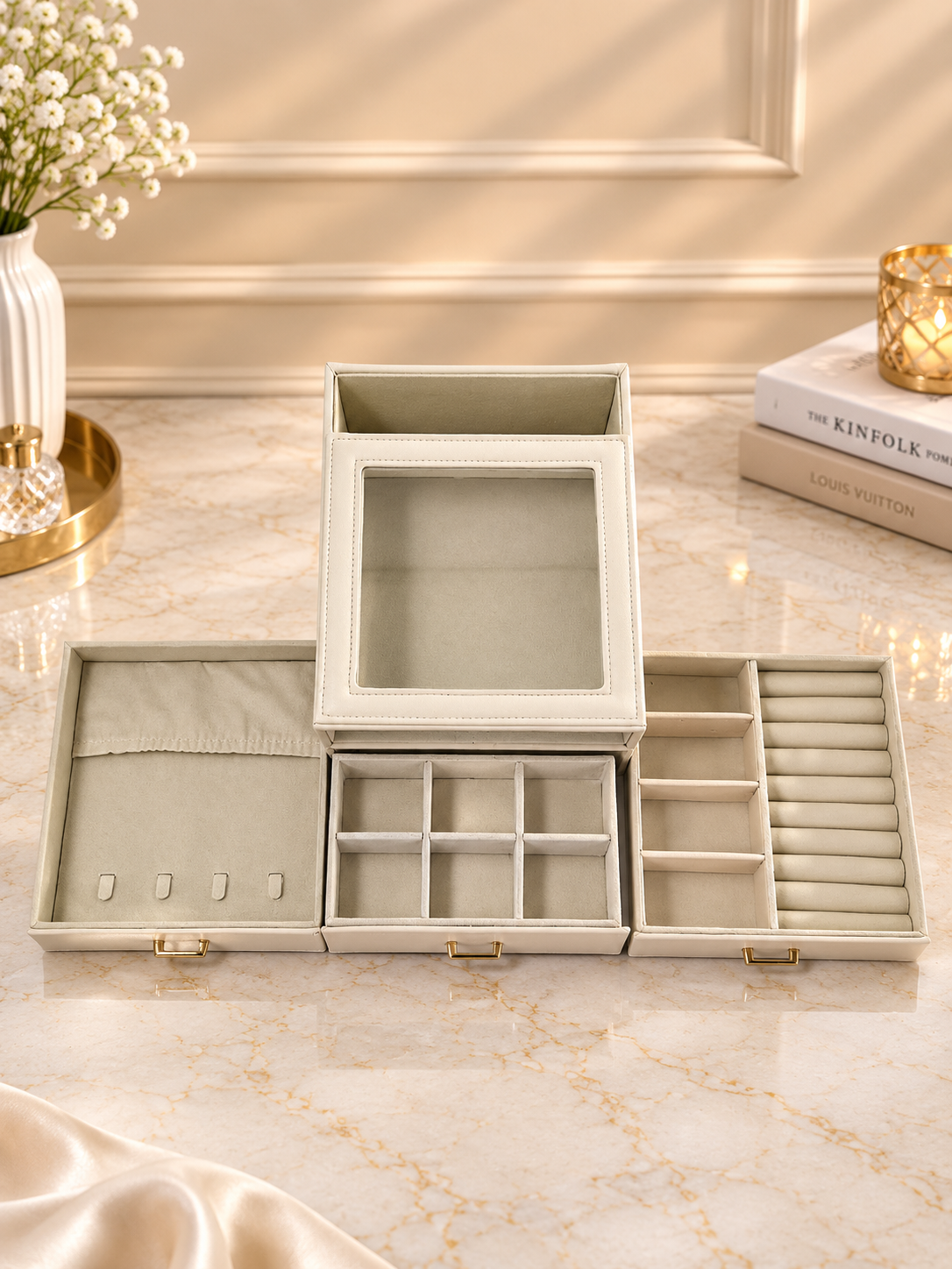 Ivory jewelry box with open compartments and lower drawers
