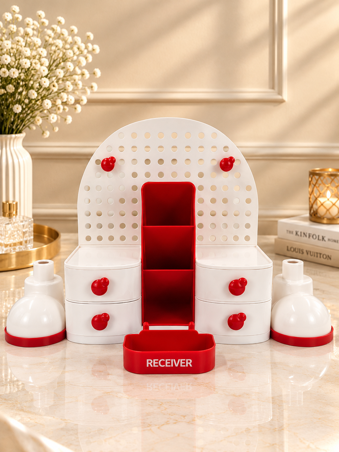 Red and white pegboard vanity organizer stand with central 3-tier slot and front receiver tray