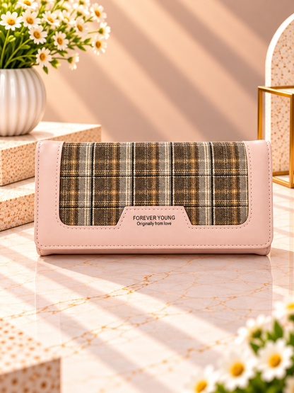 Long plaid contrast wallet with light pink outer trim and snap front flap