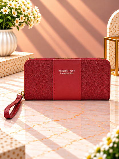 Contrast panel zip-around wristlet wallet, deep red with dark center panel and wrist strap