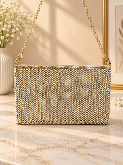 Gold crystal mesh envelope clutch with chain strap, rectangular snap flap.