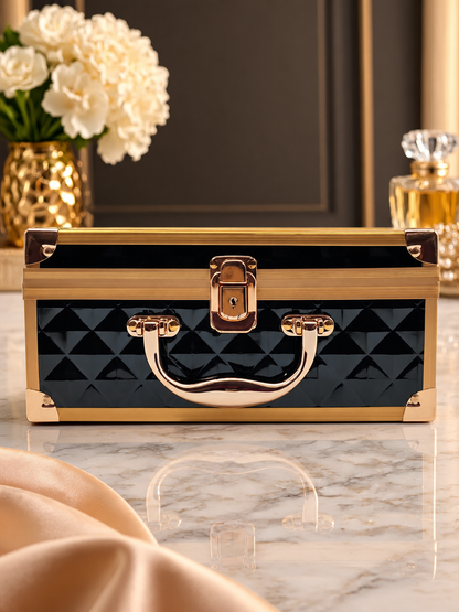 Closed diamond-quilted vanity box with rose gold handle and latch, glossy hard shell