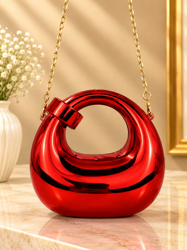Red metallic ring-loop evening handbag with gold chain strap and hinged handle