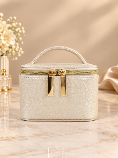 Cream faux-leather travel jewelry case with carry handle and gold double zipper