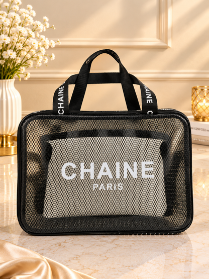 Black mesh and clear travel toiletry bag with CHAINE Paris logo and zipper