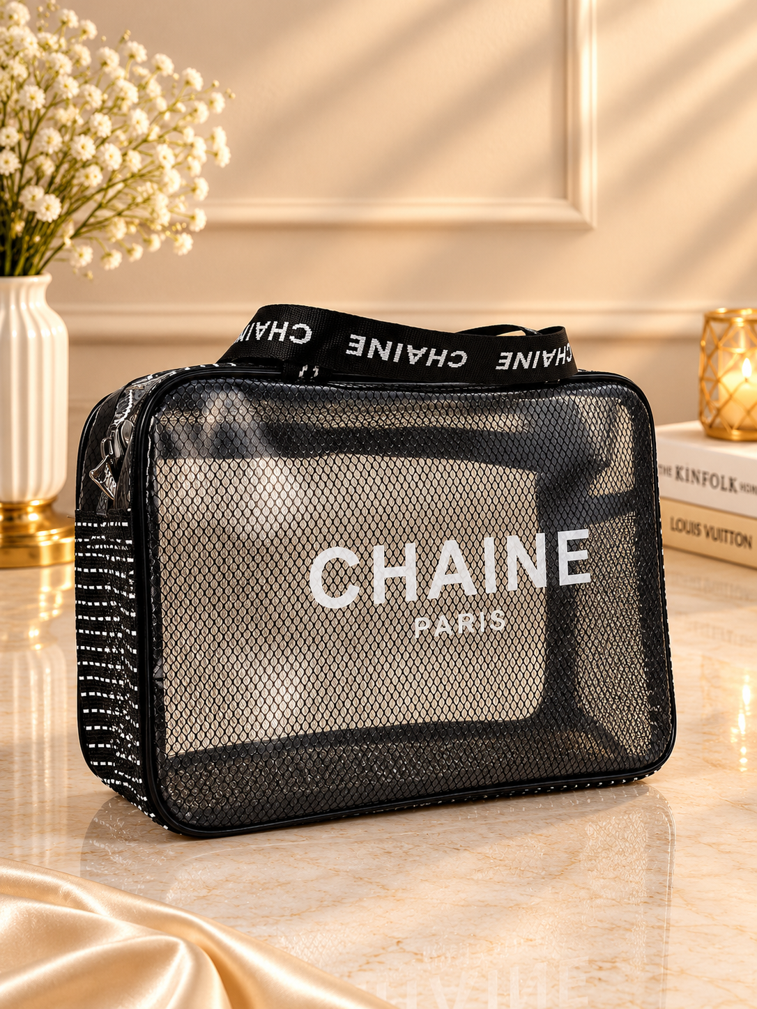 Black mesh and clear travel toiletry bag with CHAINE Paris front panel and logo strap
