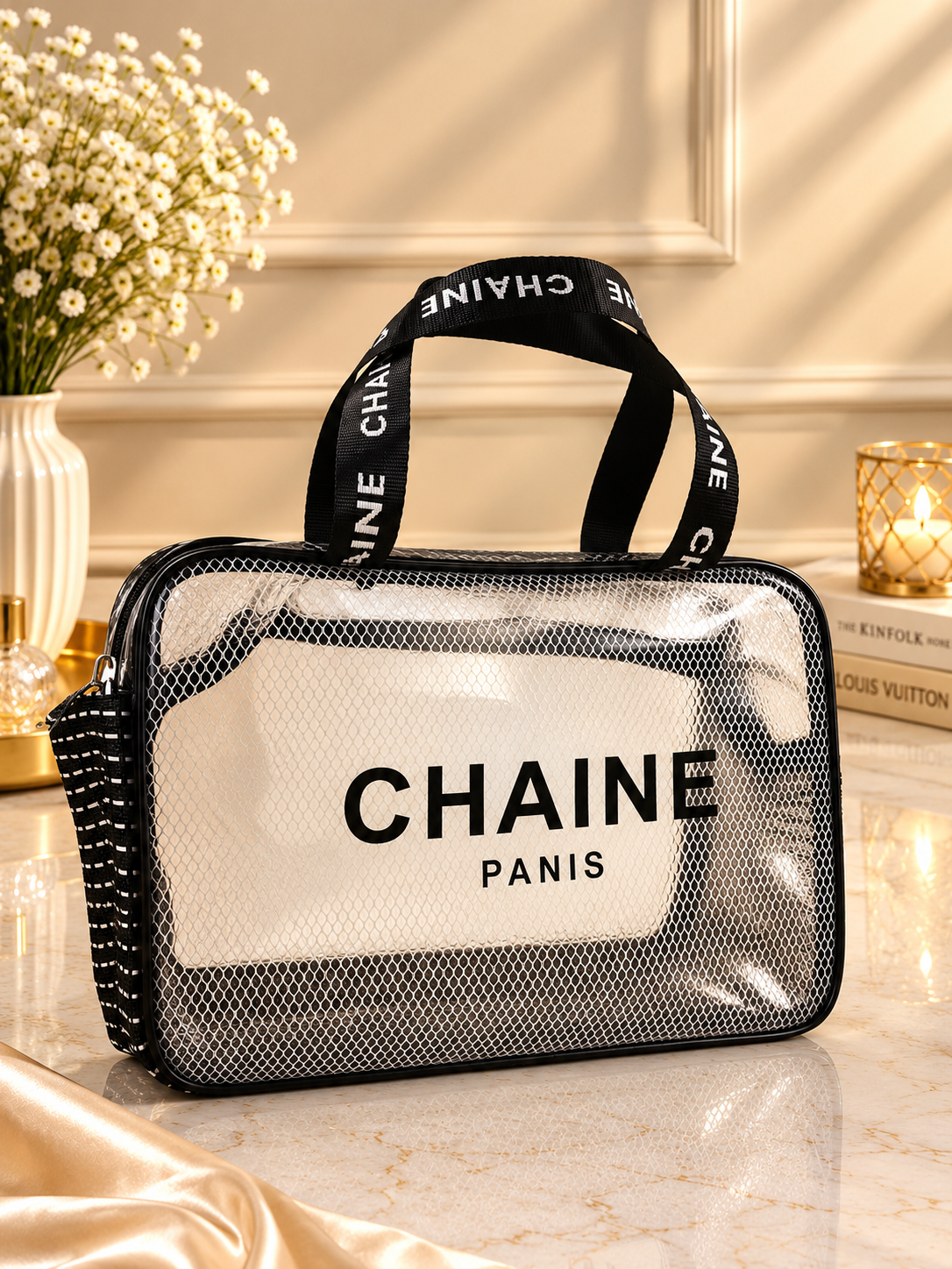 Black mesh and clear travel toiletry bag with front CHAINE Paris label and top handle