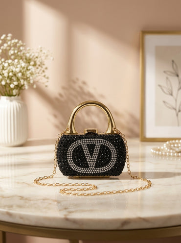 Black crystal-encrusted mini minaudiere handbag with V monogram and gold-tone handle