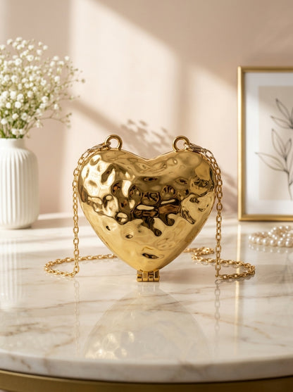 Gold hammered metallic heart evening clutch with chain strap
