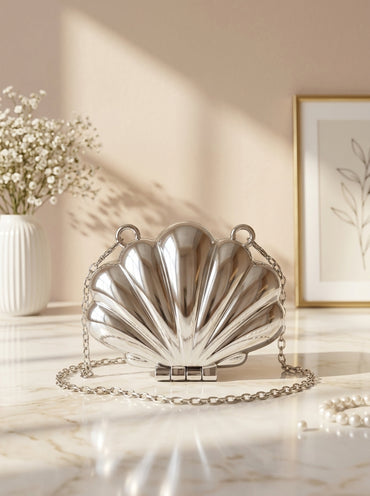 Silver metallic seashell evening clutch bag with chain strap and clasp closure