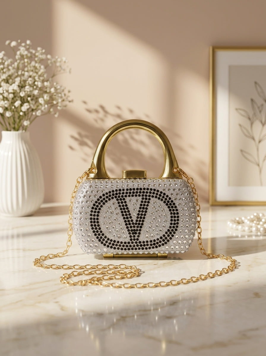 Silver crystal-encrusted mini minaudiere handbag with V monogram and chain strap