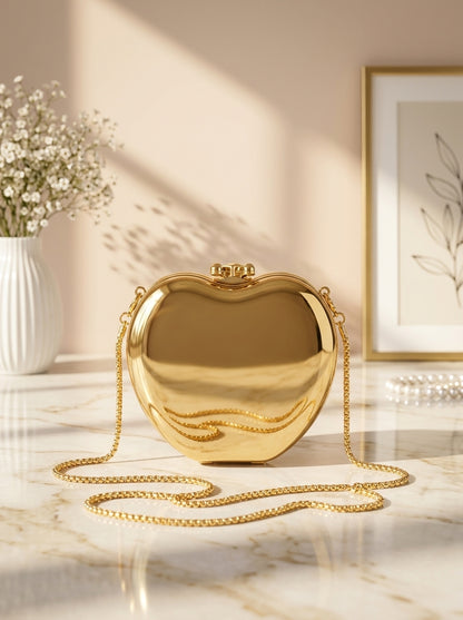 Gold metallic heart evening clutch with top clasp and shoulder chain