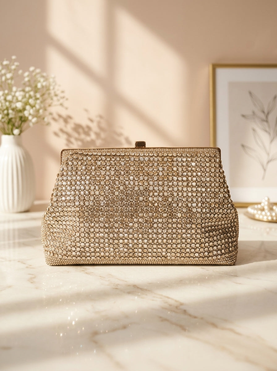 Gold-tone crystal evening clutch with structured top frame clasp