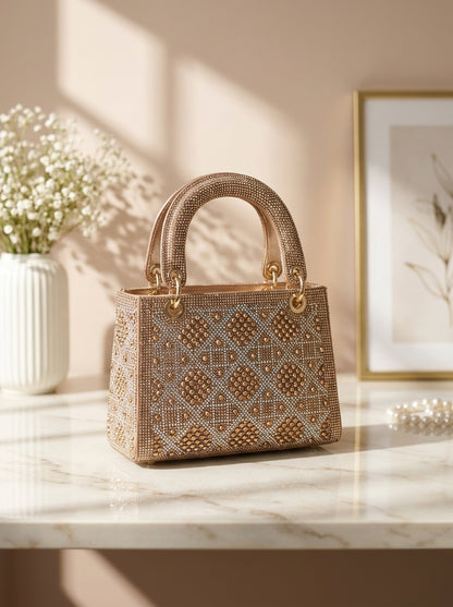 Geometric crystal embellished evening clutch with structured top handle, champagne gold