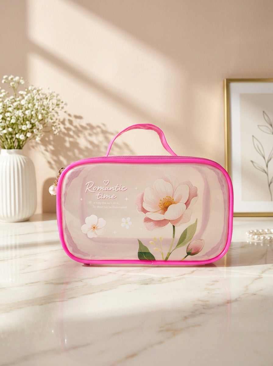 Hot pink transparent cosmetic pouch with floral print, zip closure and top handle