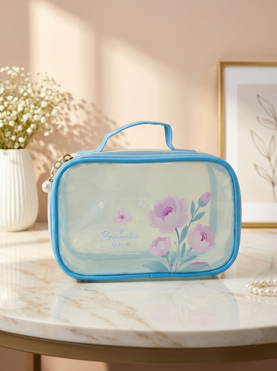 Sky blue transparent cosmetic pouch with floral print, zip closure and top handle
