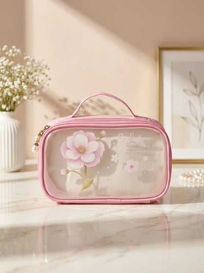 Pink transparent cosmetic pouch with floral print, zip closure and top handle