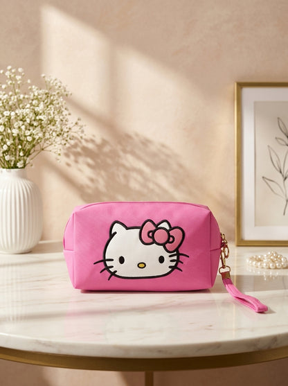 Hello Kitty canvas cosmetic pouch in hot pink, Hello Kitty face graphic and wrist strap