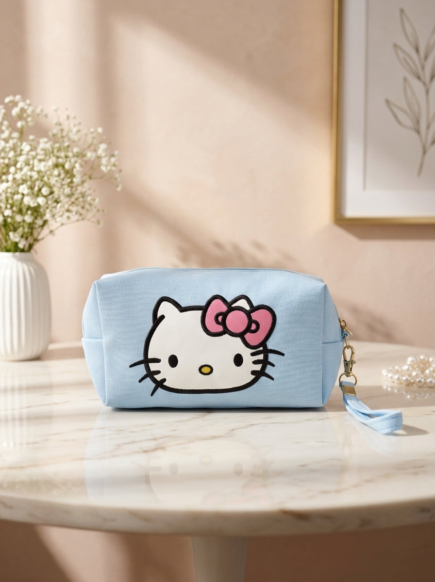 Hello Kitty canvas cosmetic pouch in light blue, bow-face graphic and zipper top