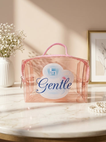 Peach transparent cosmetic pouch with handle and “Gentle” graphic print