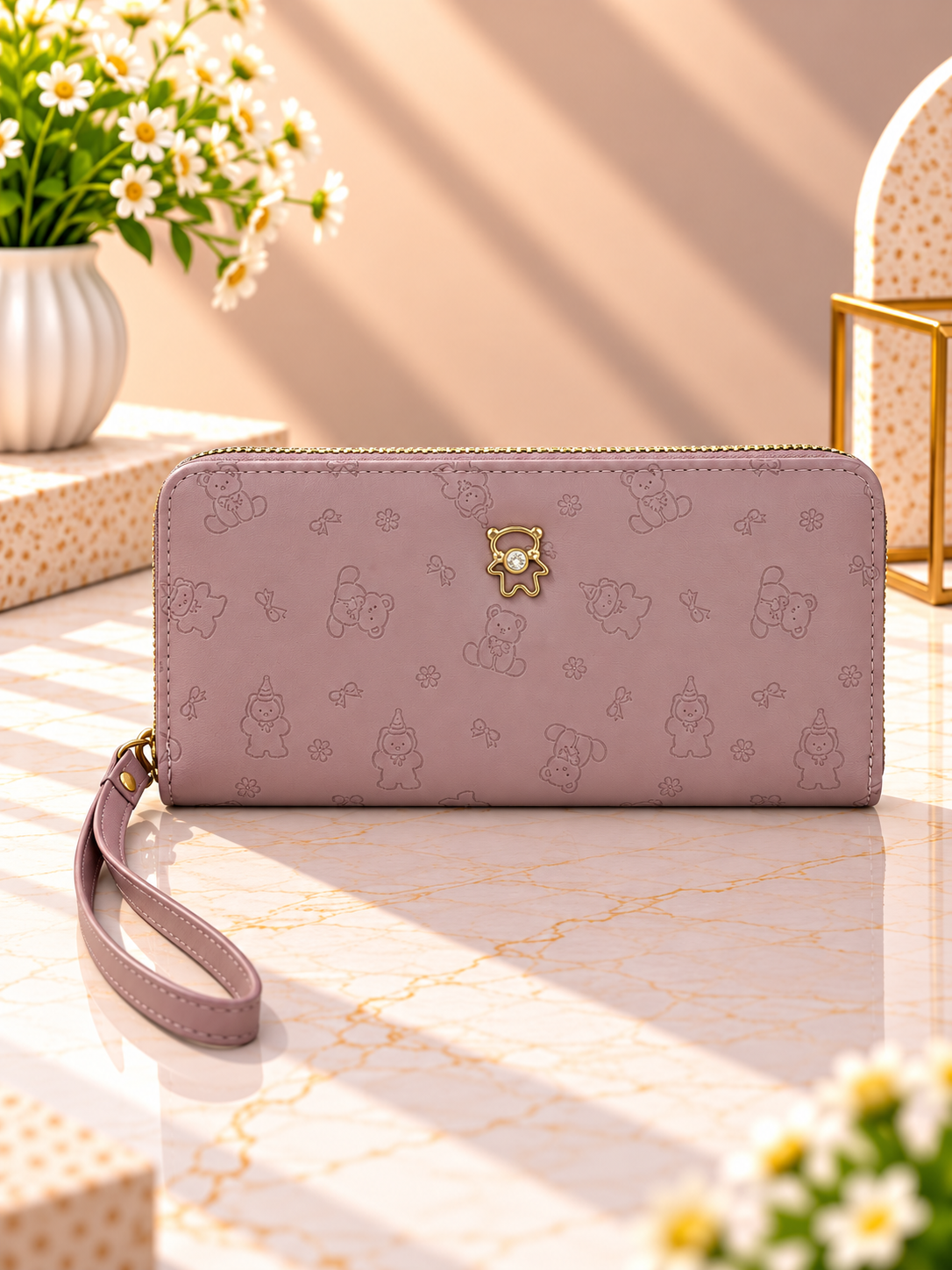 Rose zip-around wristlet wallet with debossed character pattern and wrist strap