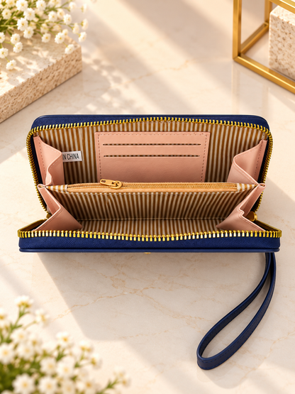 Open blue zip-around wristlet wallet showing striped lining and inside card slots