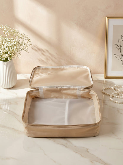 Beige waterproof travel beauty organizer with zip lid and mesh inner compartments