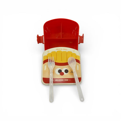 Kids lunch box opened with red lid, includes fork and spoon, cartoon fries design.