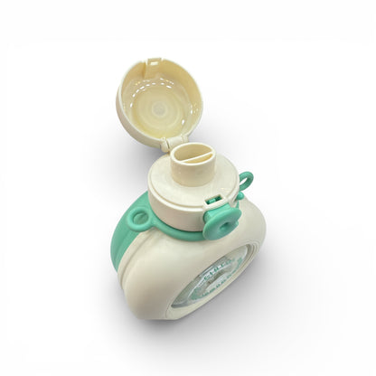 Cream water bottle with mint green lid ring and open cup mouth, top view.