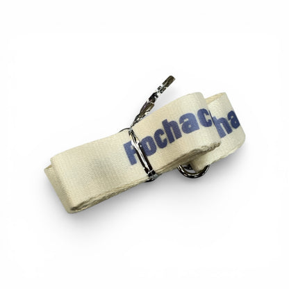 Beige fabric bottle strap with blue Pochacco text and metal keyring clips