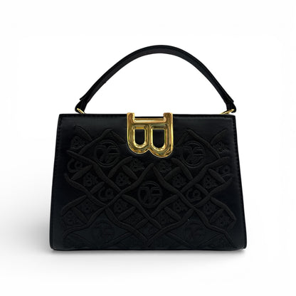 Black embossed luxury handbag with gold B-lock frame clasp and top handles