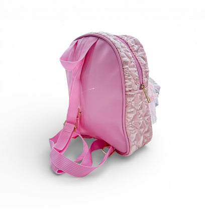 Pink quilted backpack with doll detail and adjustable shoulder strap, side view